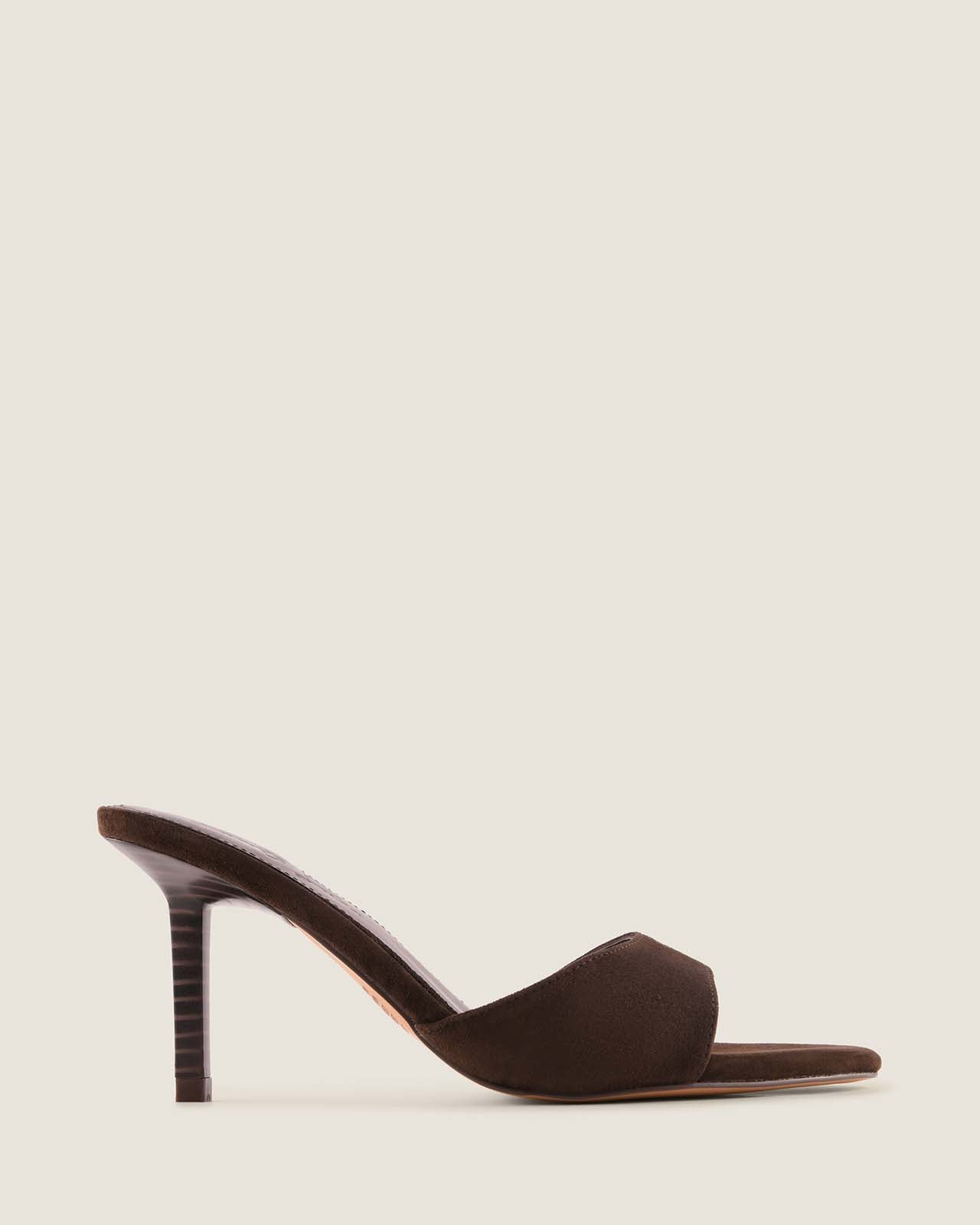 Brown open-toe high-heeled shoe on a light beige background
