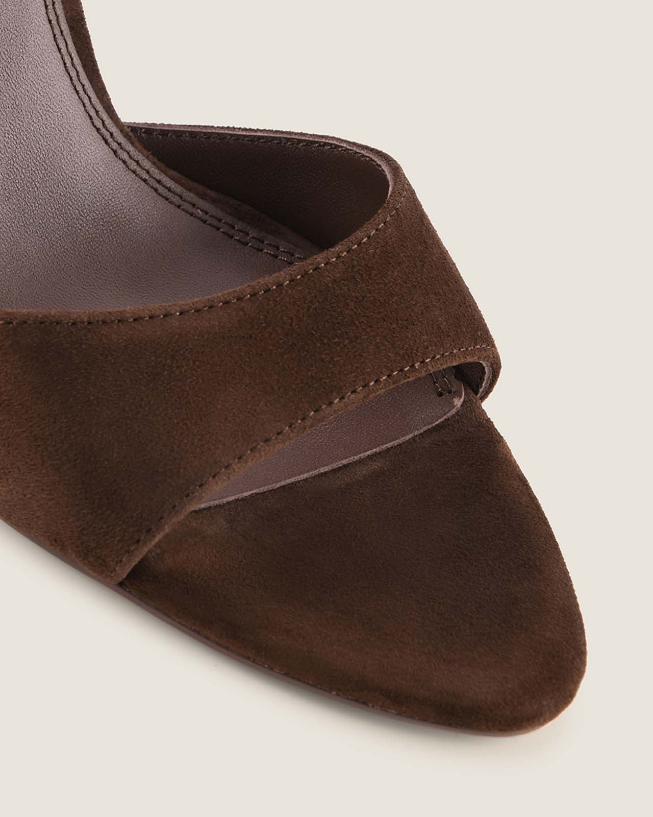 Brown suede shoe on a beige background