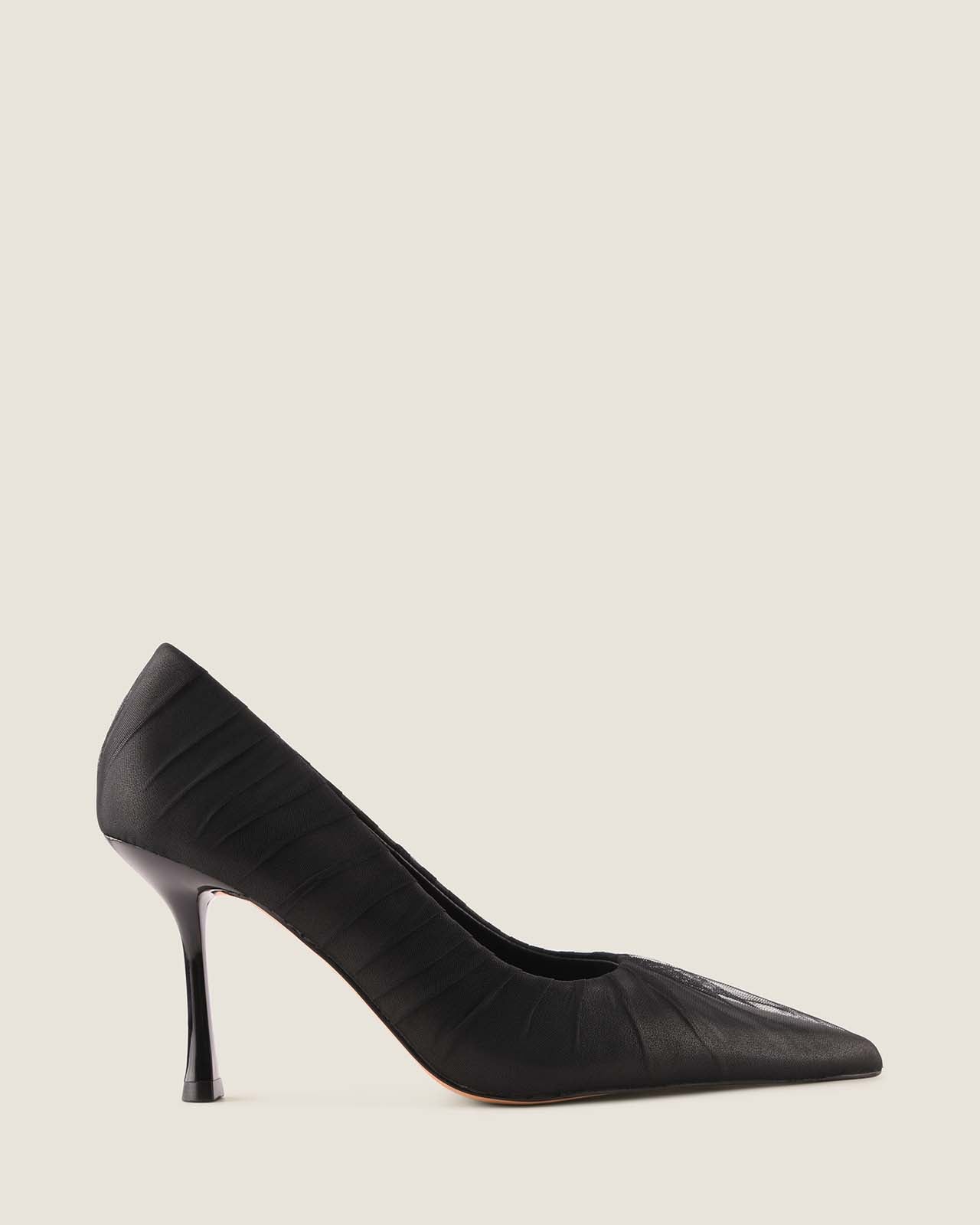 Black high-heeled shoe with a ruched detailing on a white background