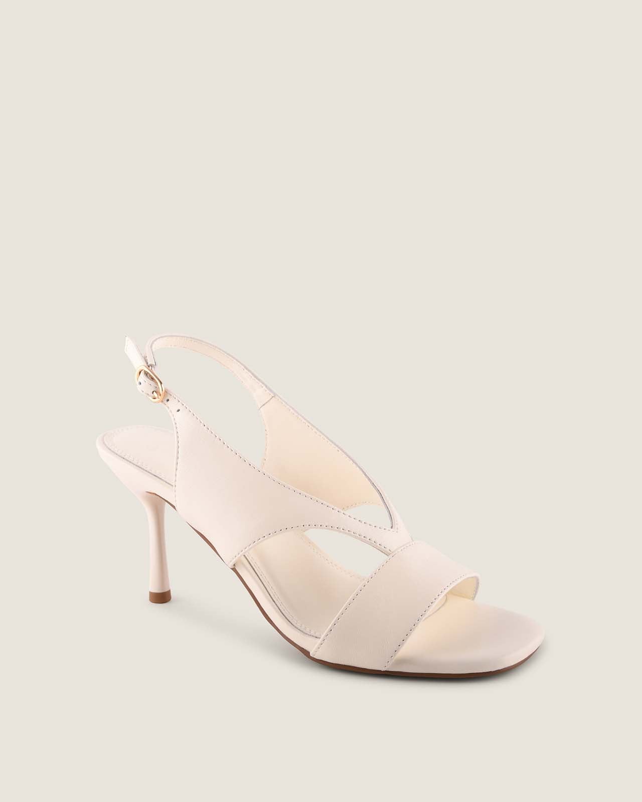 White high-heeled sandal on a light grey background