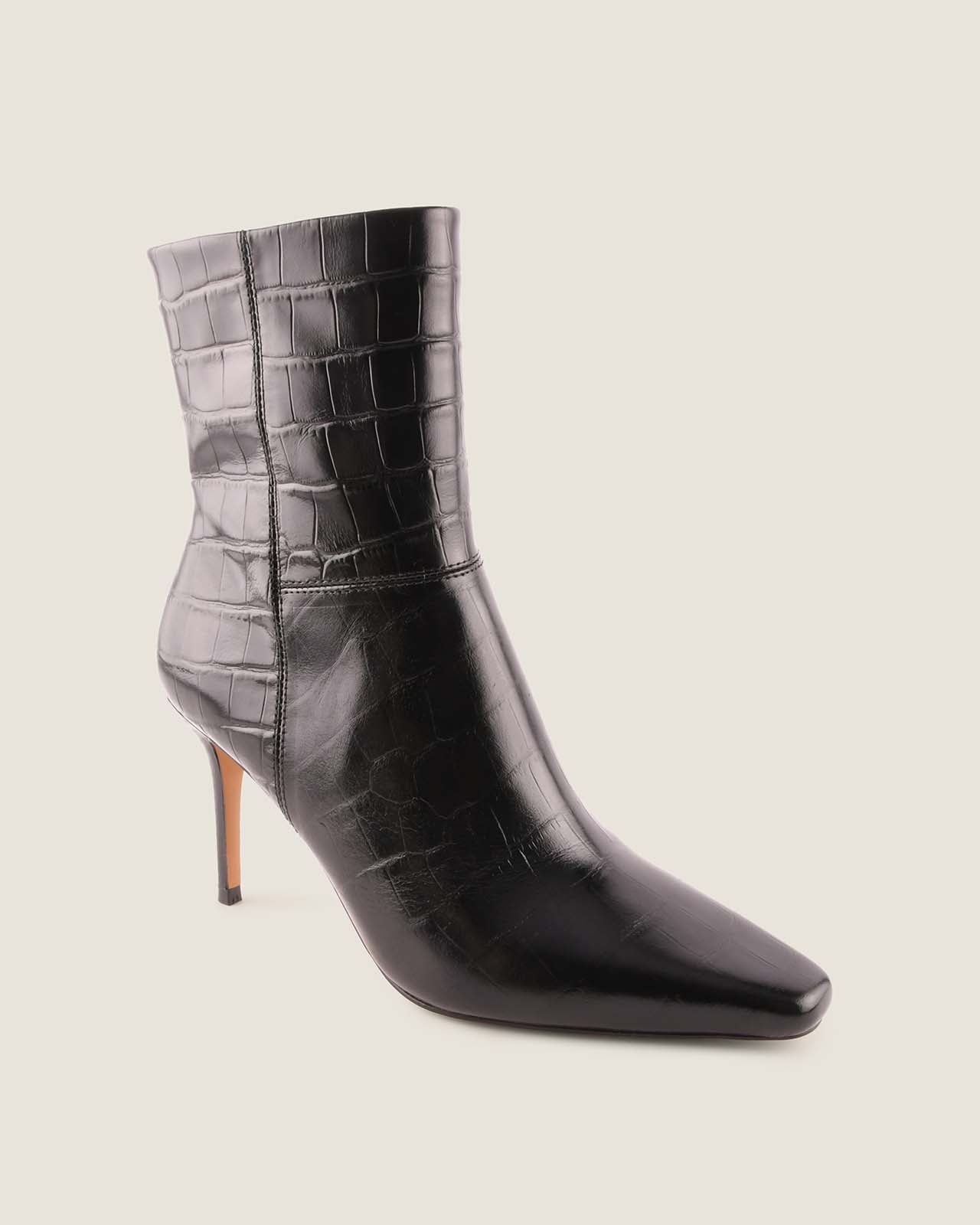 Black crocodile-patterned high-heeled ankle boot on a light grey background