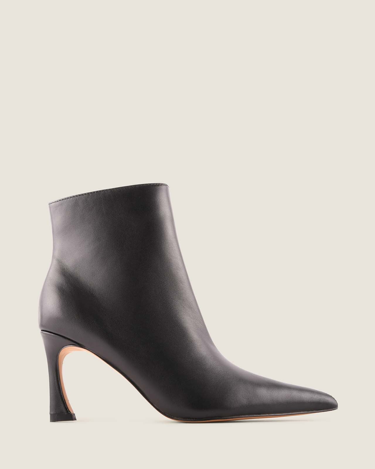 Black ankle boot on a light grey background