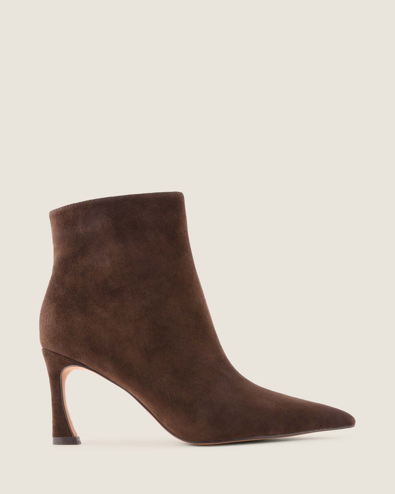 Brown suede ankle boot on a light beige background
