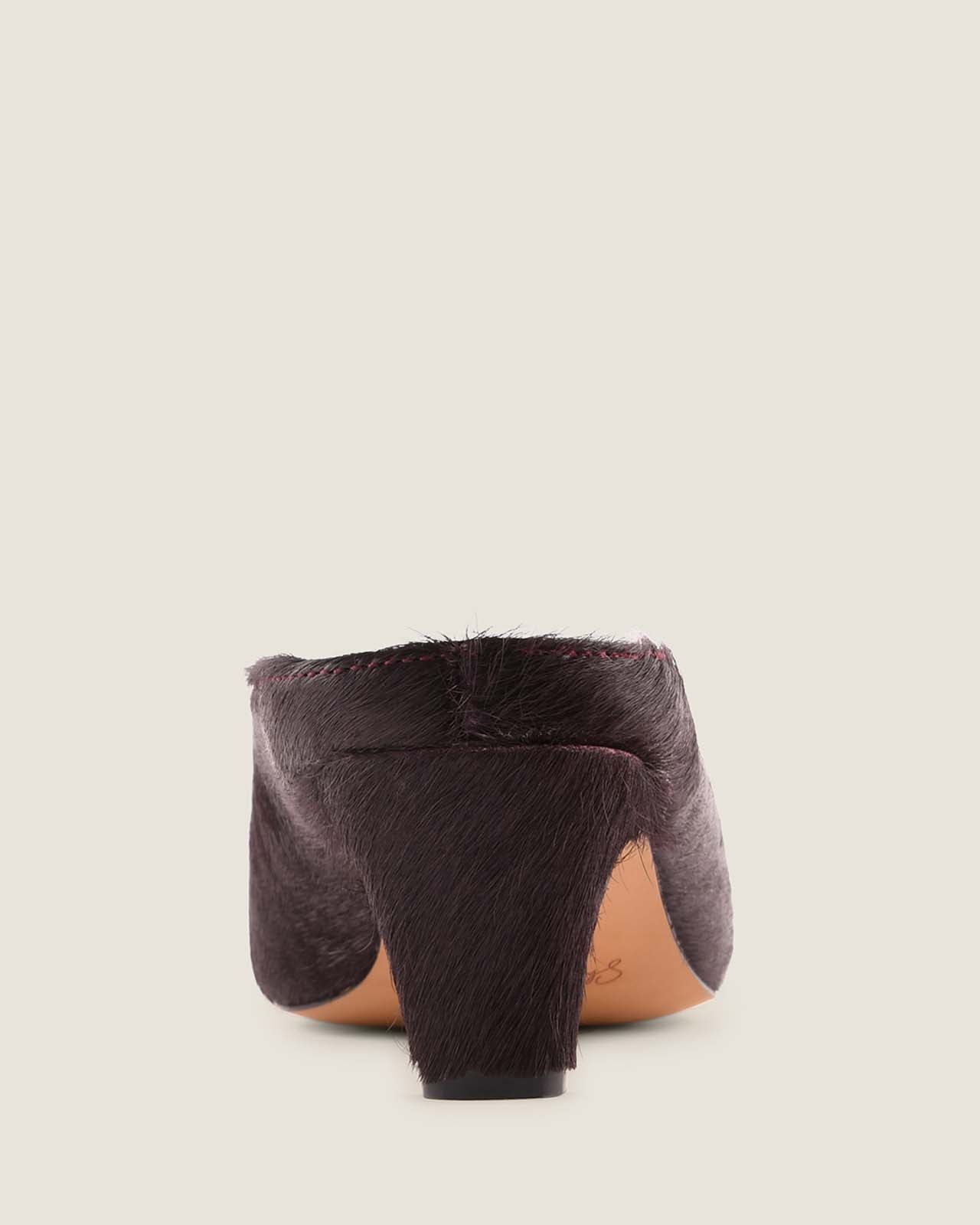 Burgundy low heel shoe on a light grey background