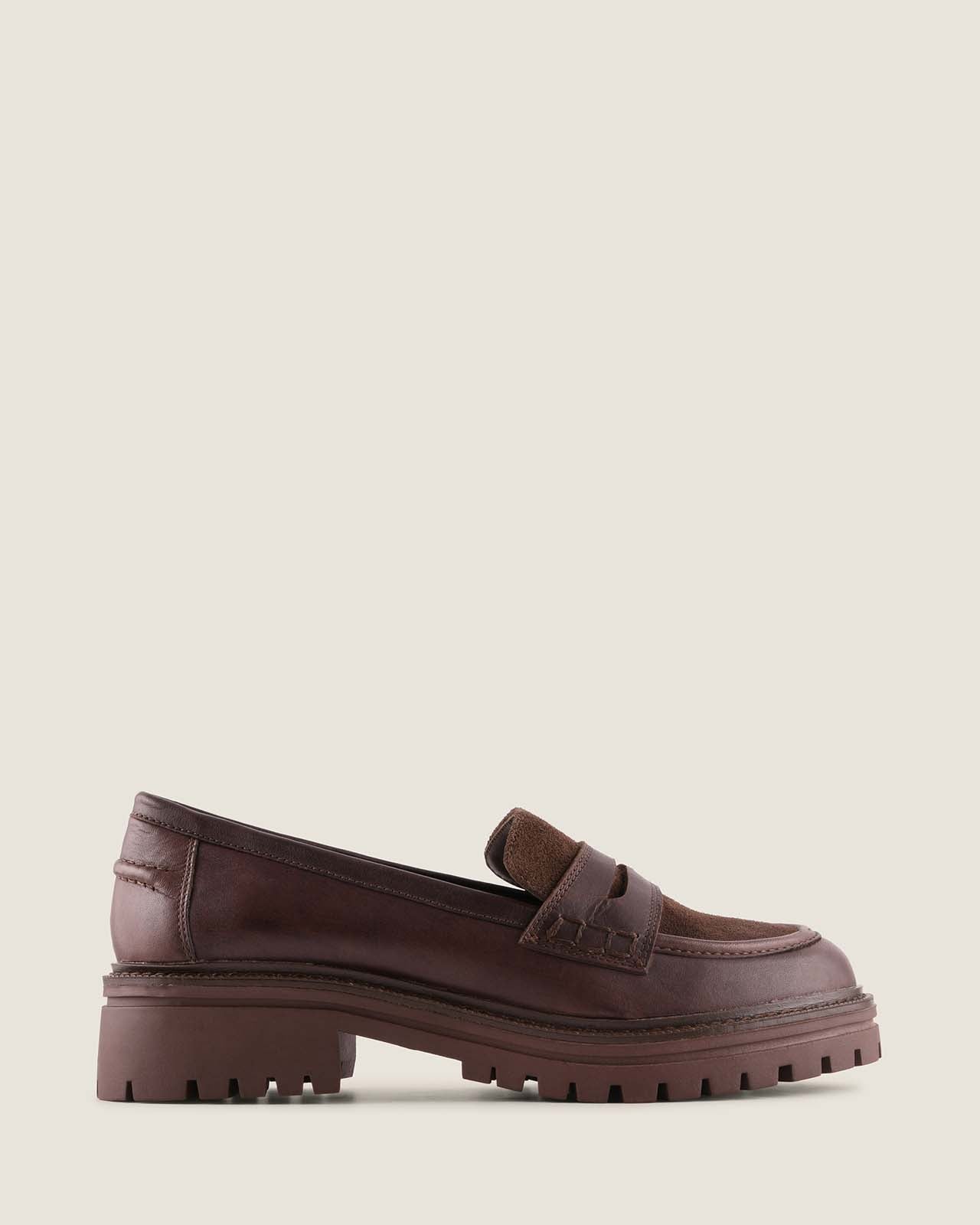 Brown leather platform loafer on a light background