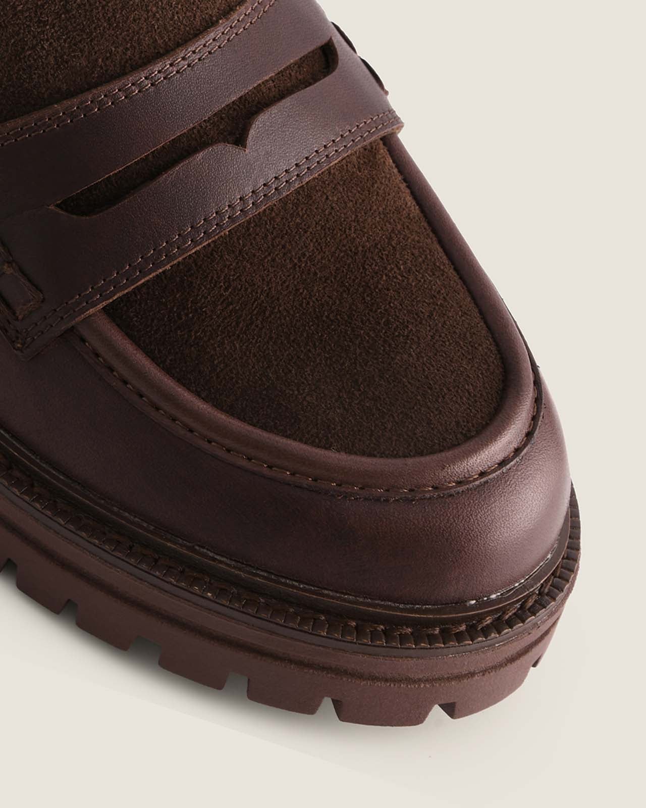 Brown leather platform loafer on a light background