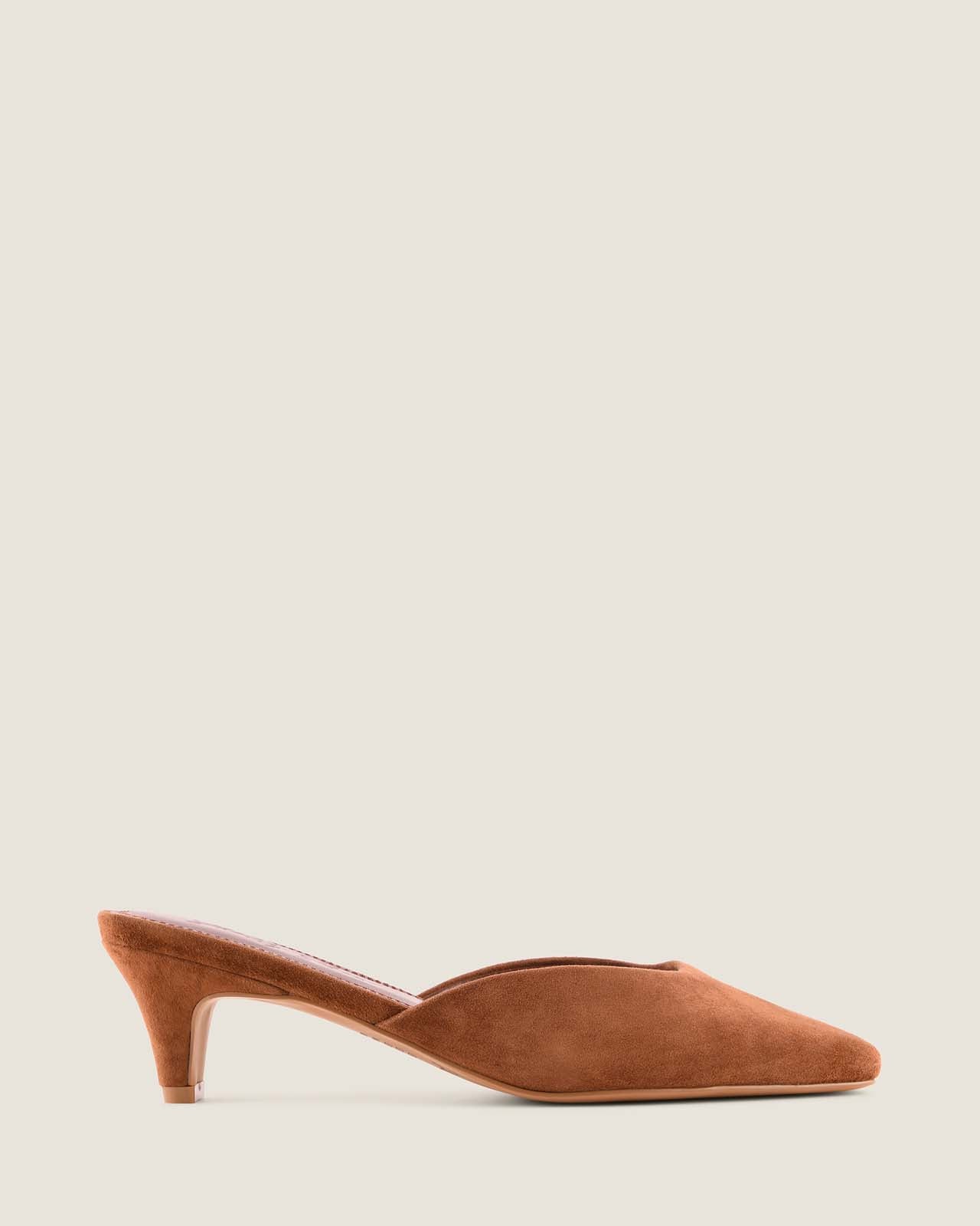 Tan suede shoe on a beige background
