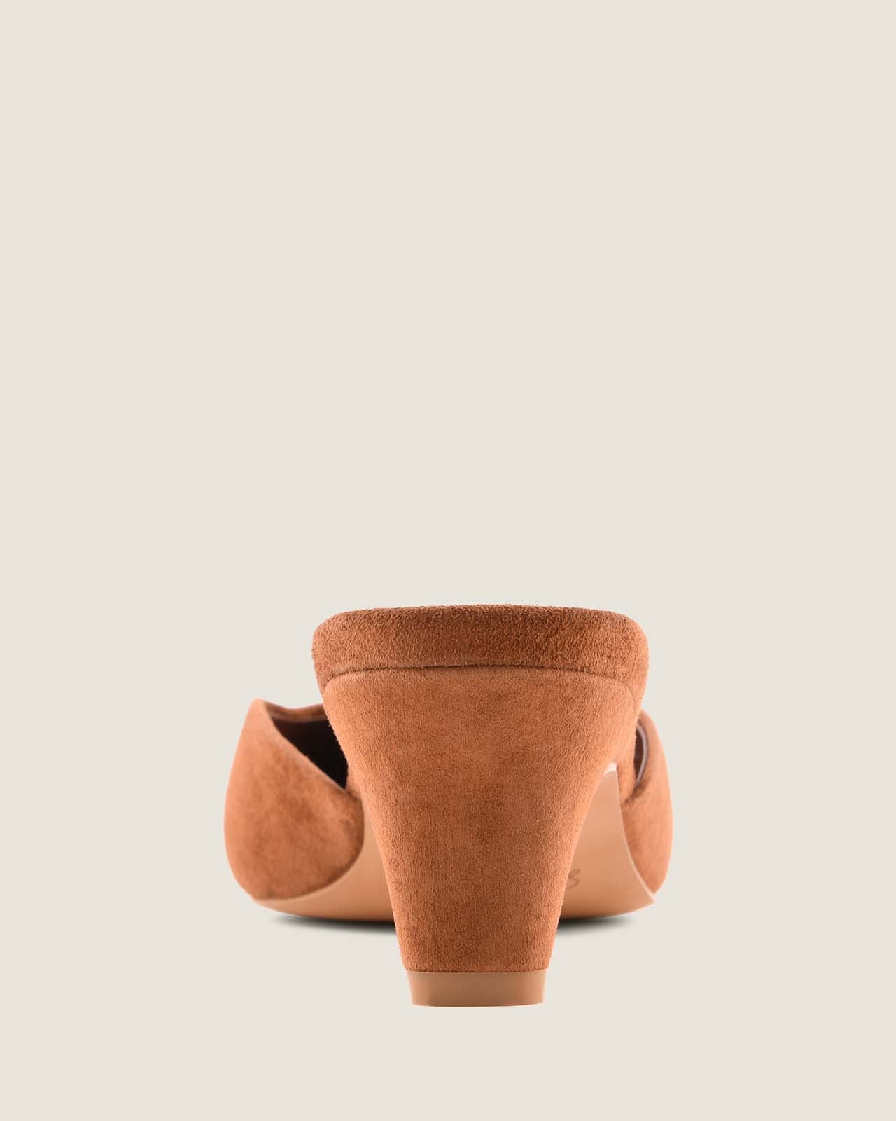 Tan suede heels on a light grey background