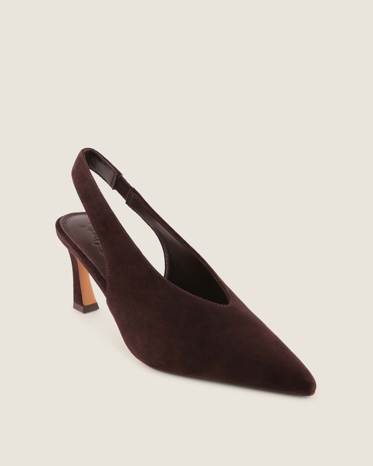 Brown suede slingback heel on a beige background