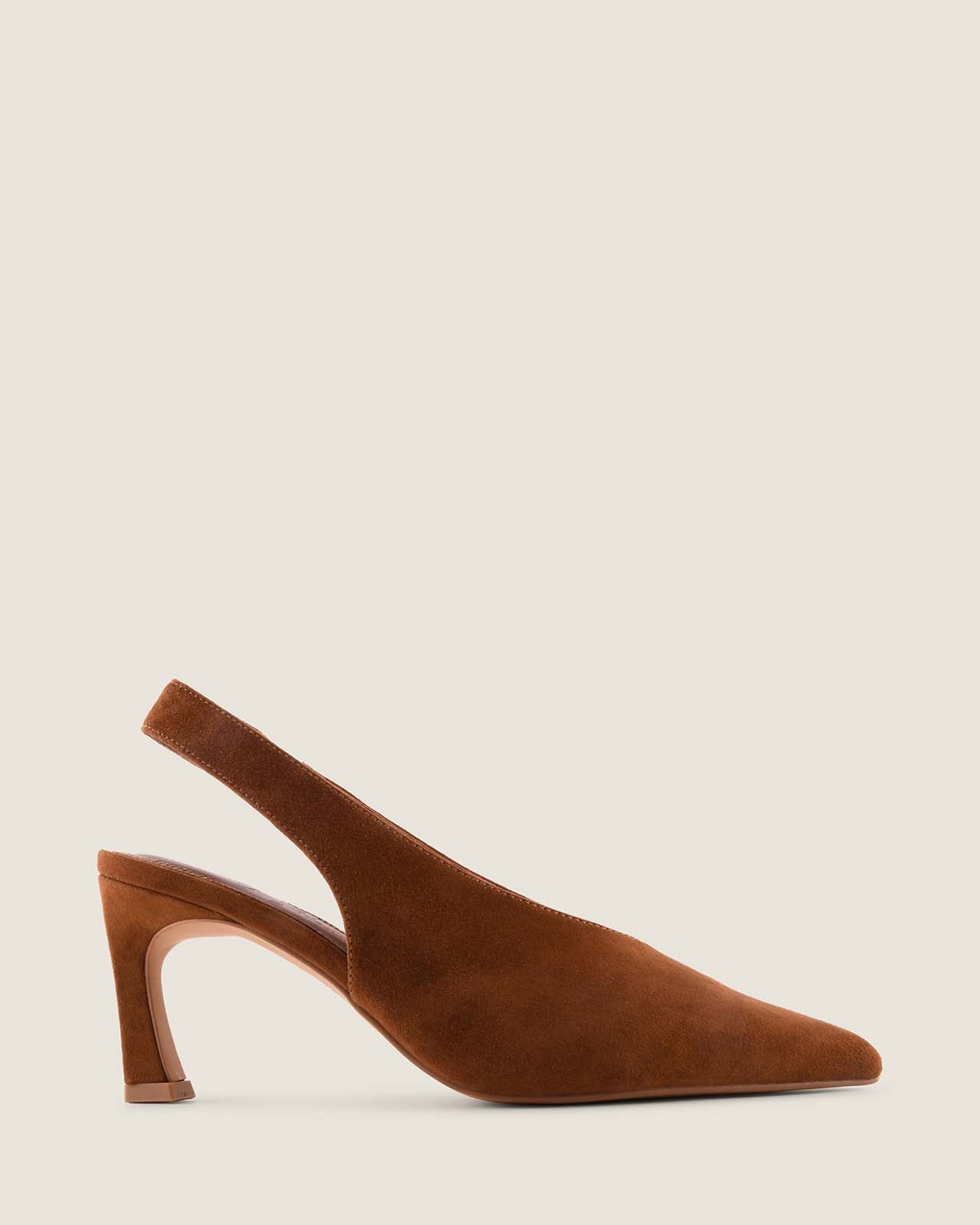 Tan suede slingback shoe on a light beige background