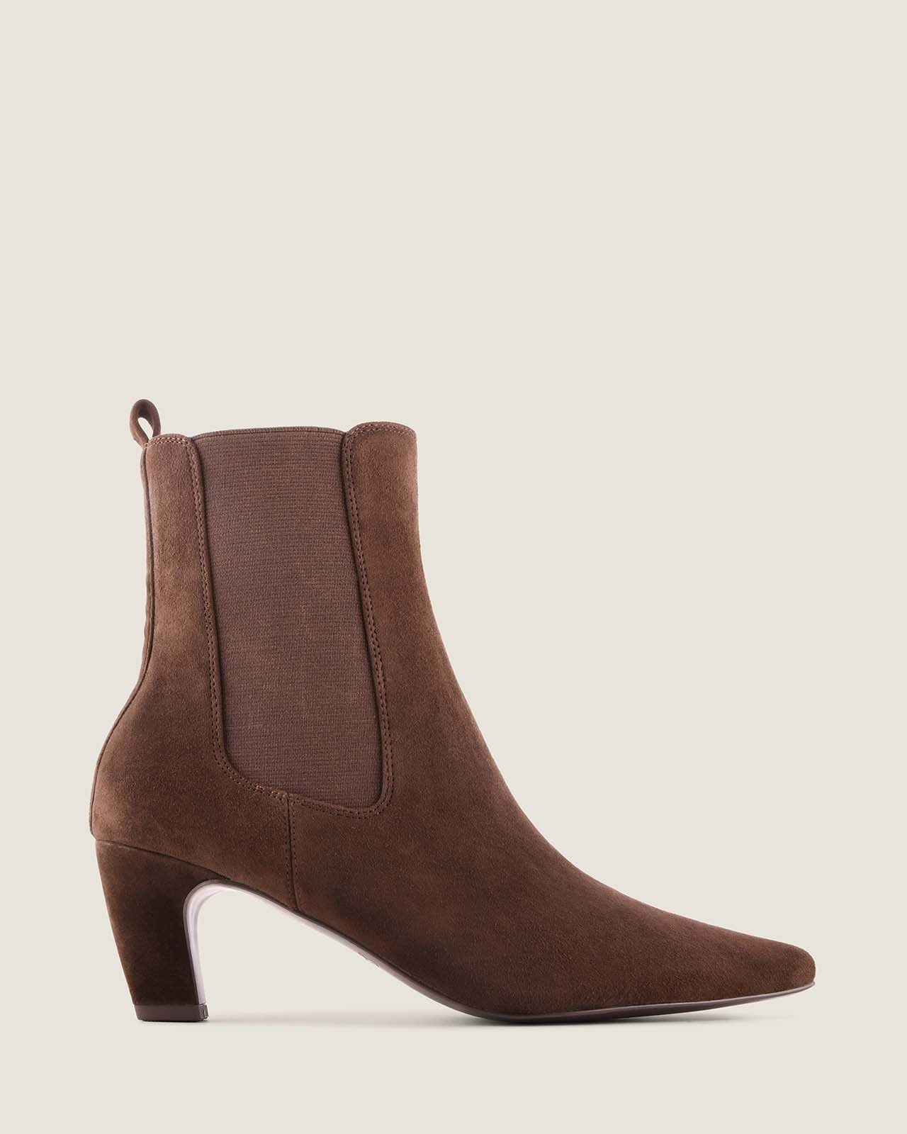 Chocolate suede ankle boot on a light beige background