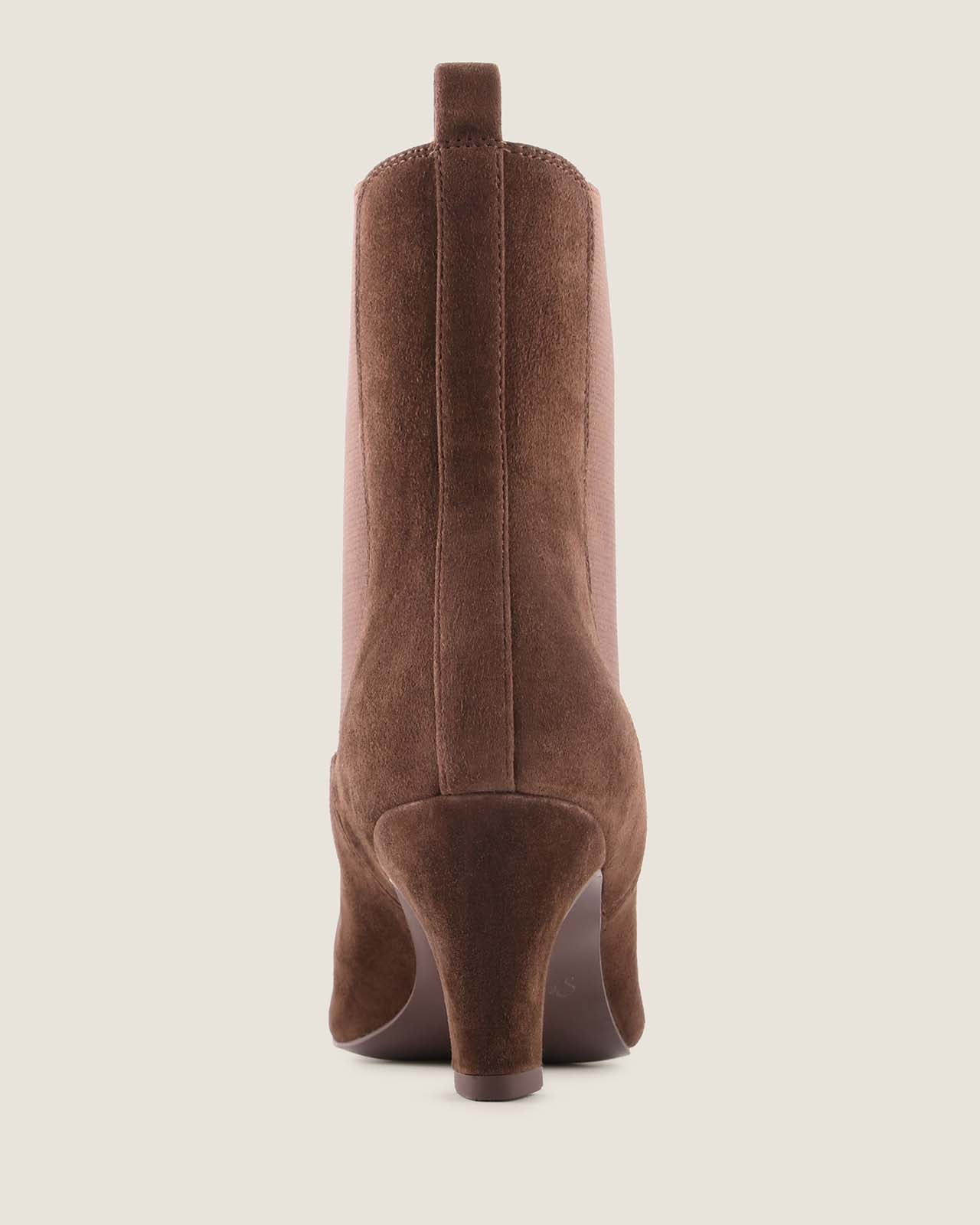Chocolate suede ankle boot on a light beige background