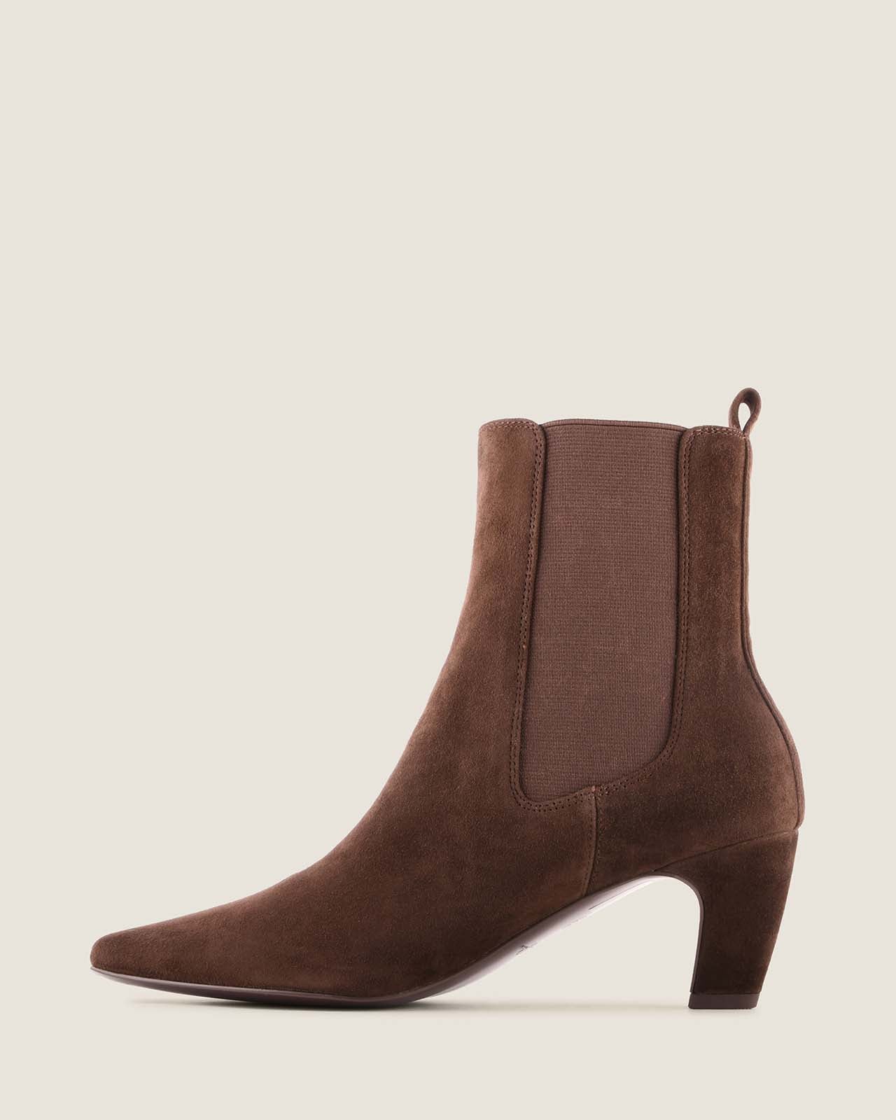 Chocolate suede ankle boot on a light beige background