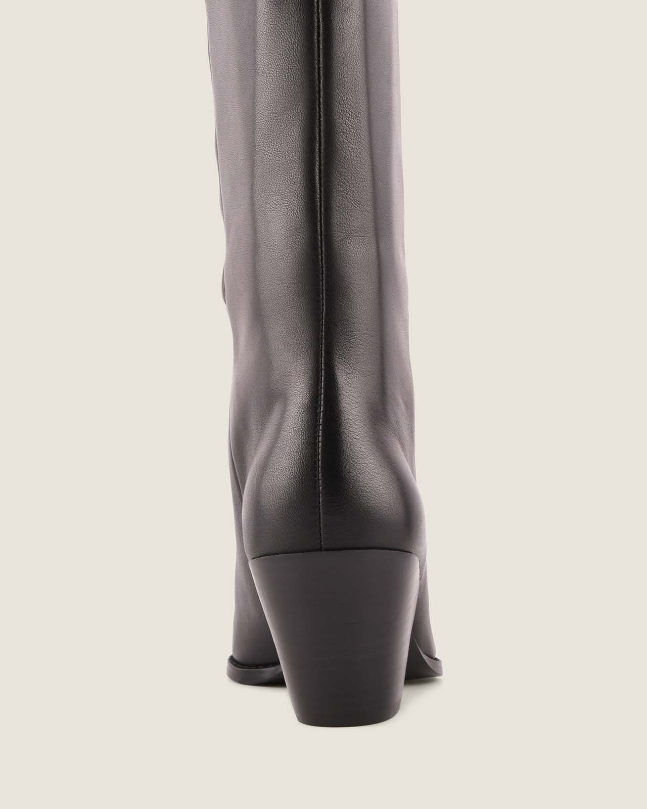 Black leather knee-high boot on a light grey background