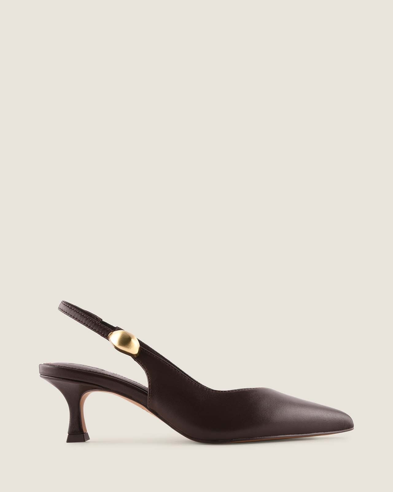Brown leather slingback heel with a gold ornament detail on a light beige background