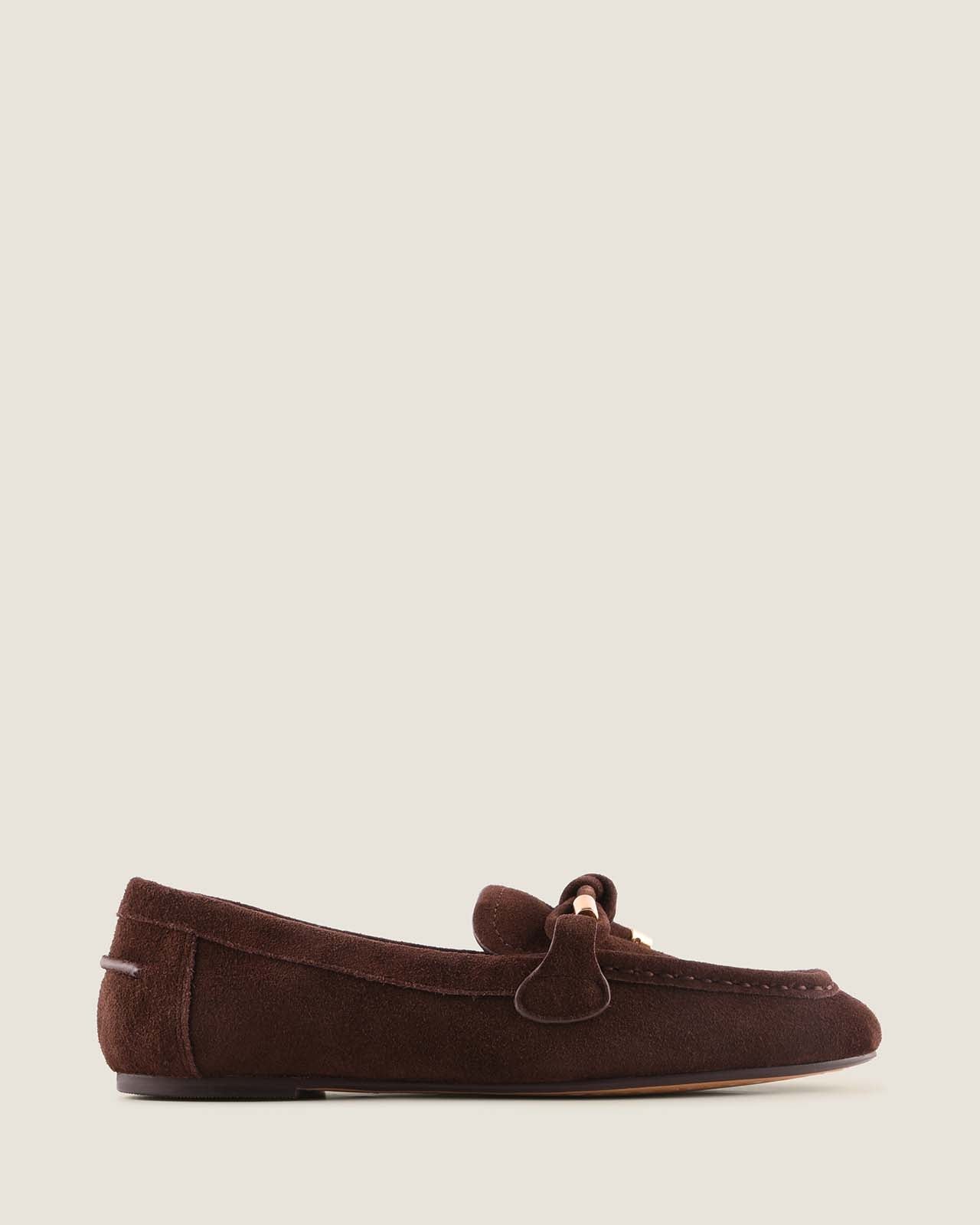 Brown suede loafer shoe on a white background