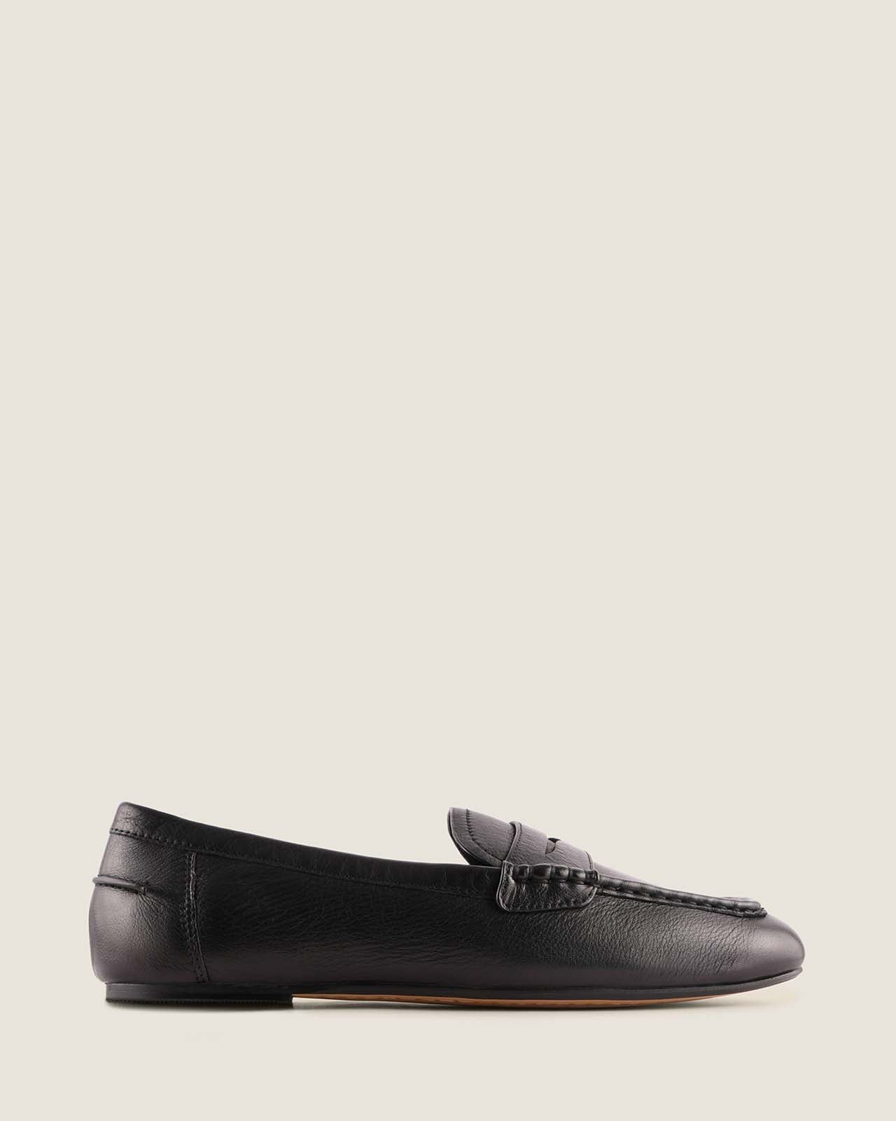 Black leather loafer shoe on a white background