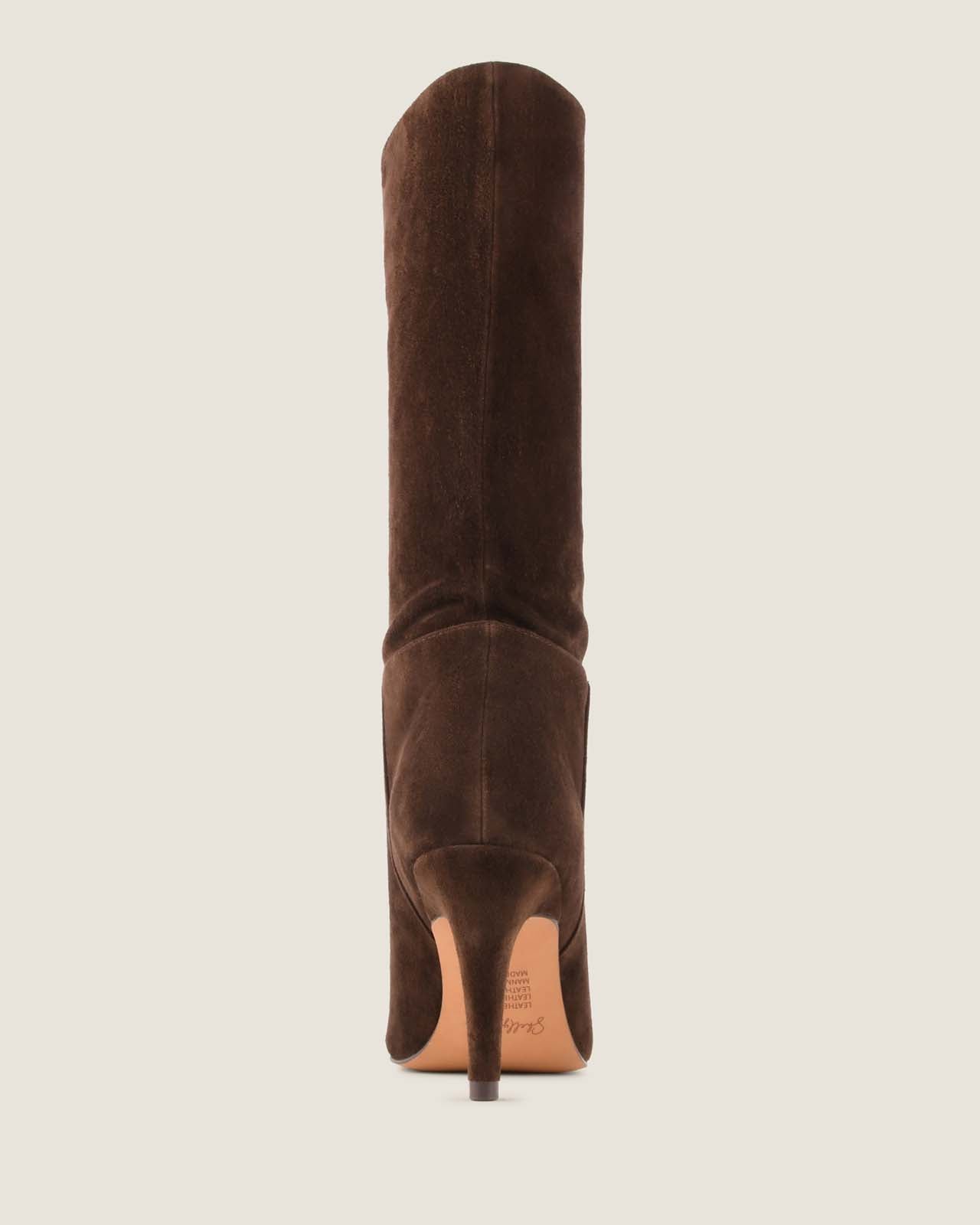 Brown suede mid-calf boot on a beige background