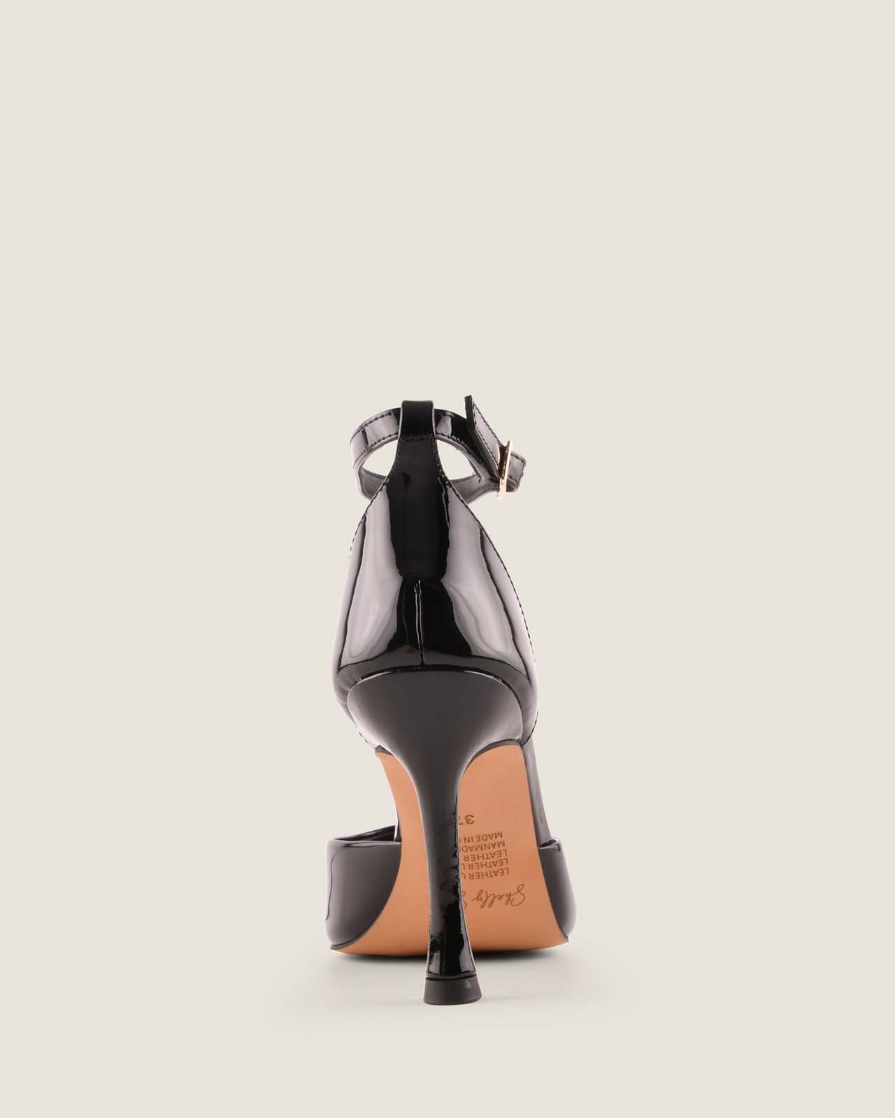 Black high-heeled shoe on a light gray background