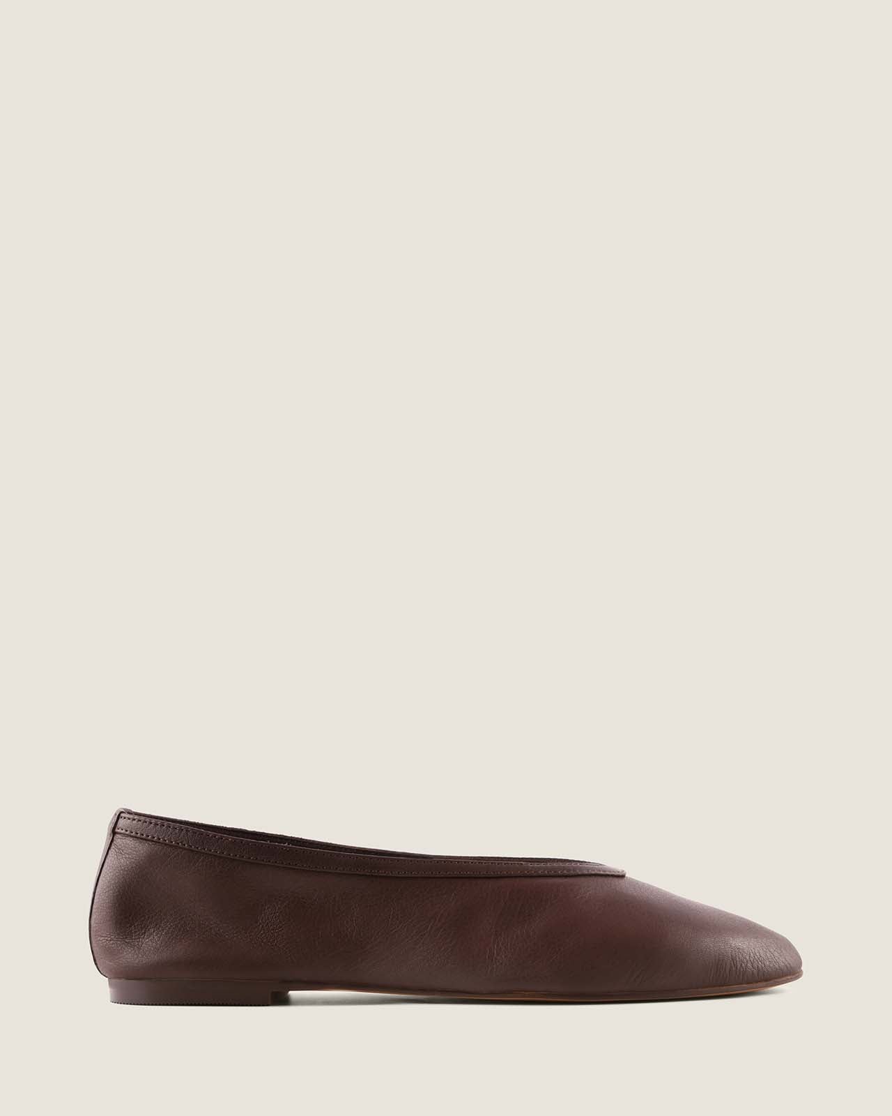 Black flat shoe on a white background