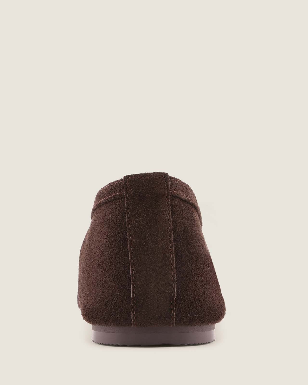 Brown shoe sole on a beige background