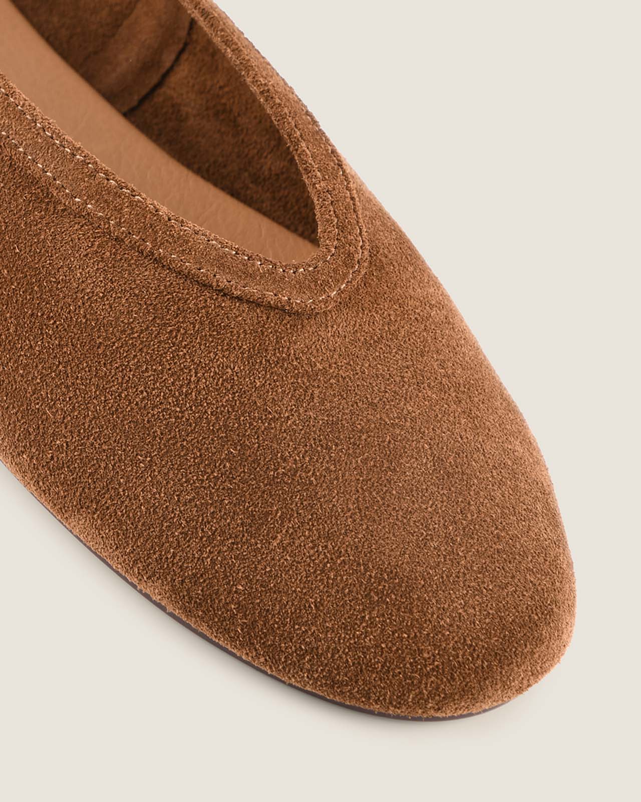 Brown slippers on a light gray background