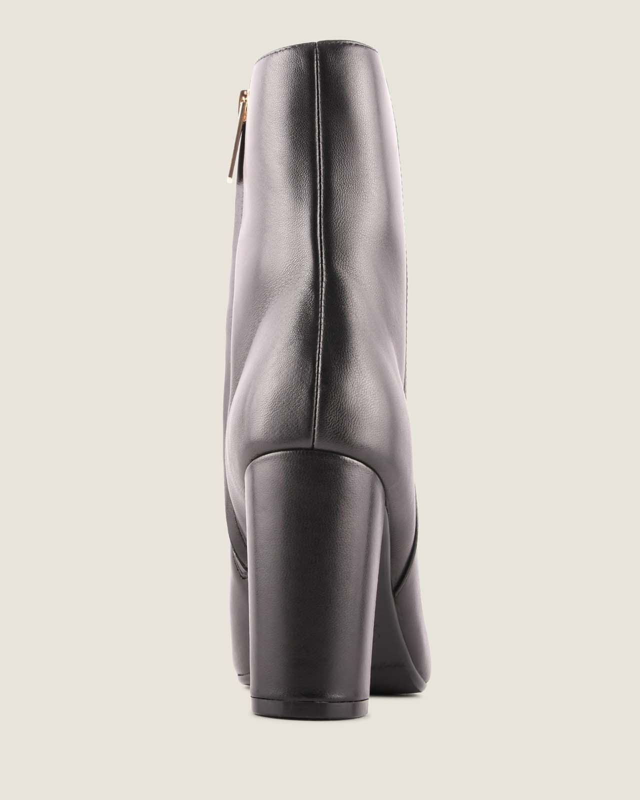 Gray ankle boot on a light gray background