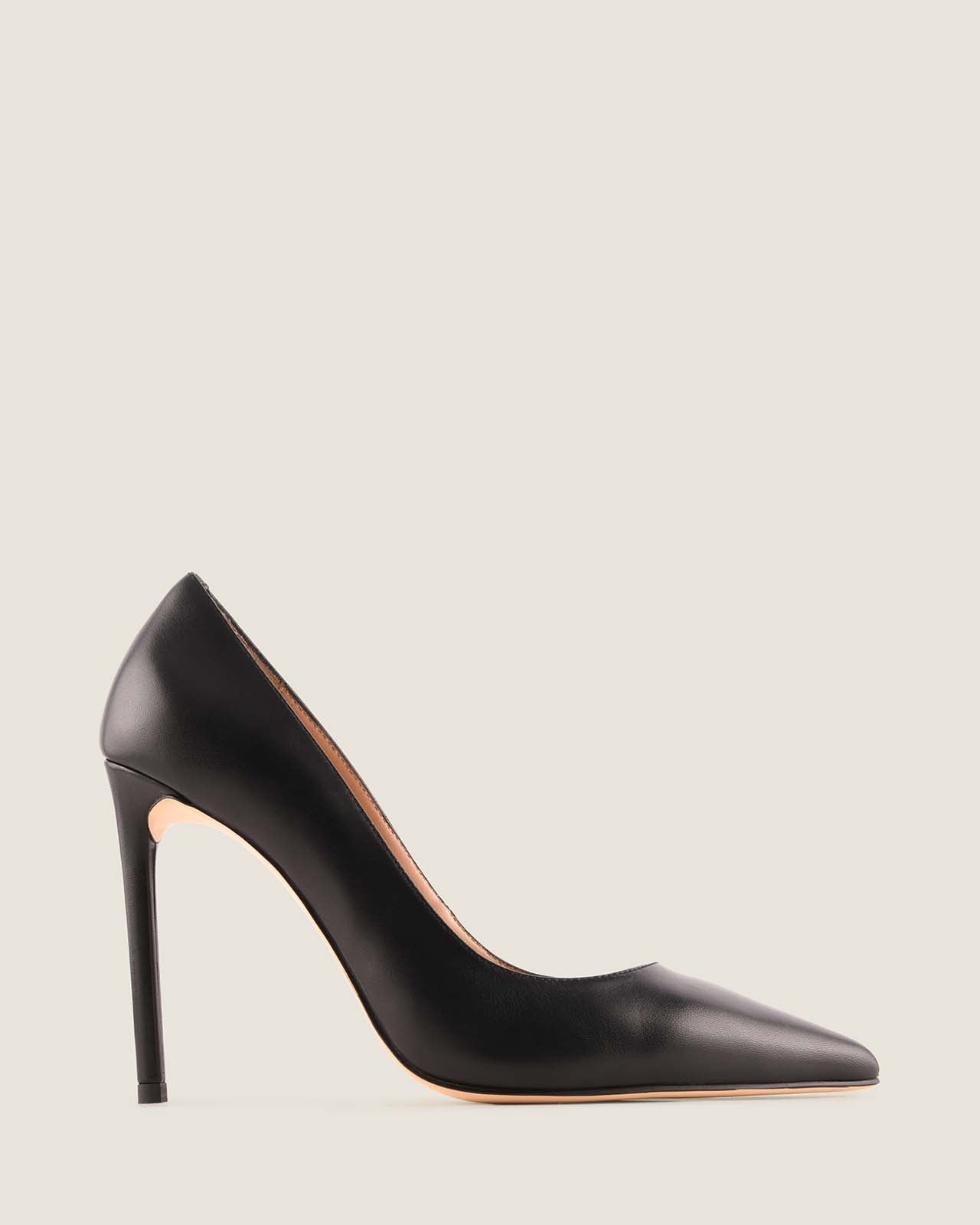 Black high-heeled shoe on a light gray background