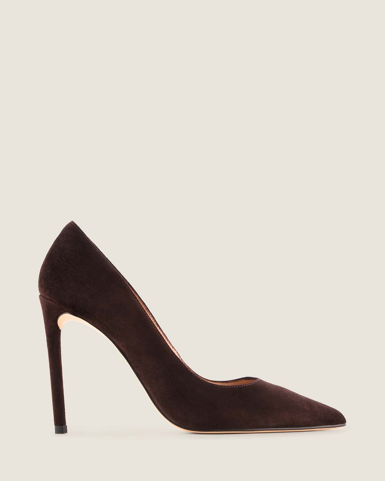 Brown high-heeled shoe with a decorative brooch on a white background