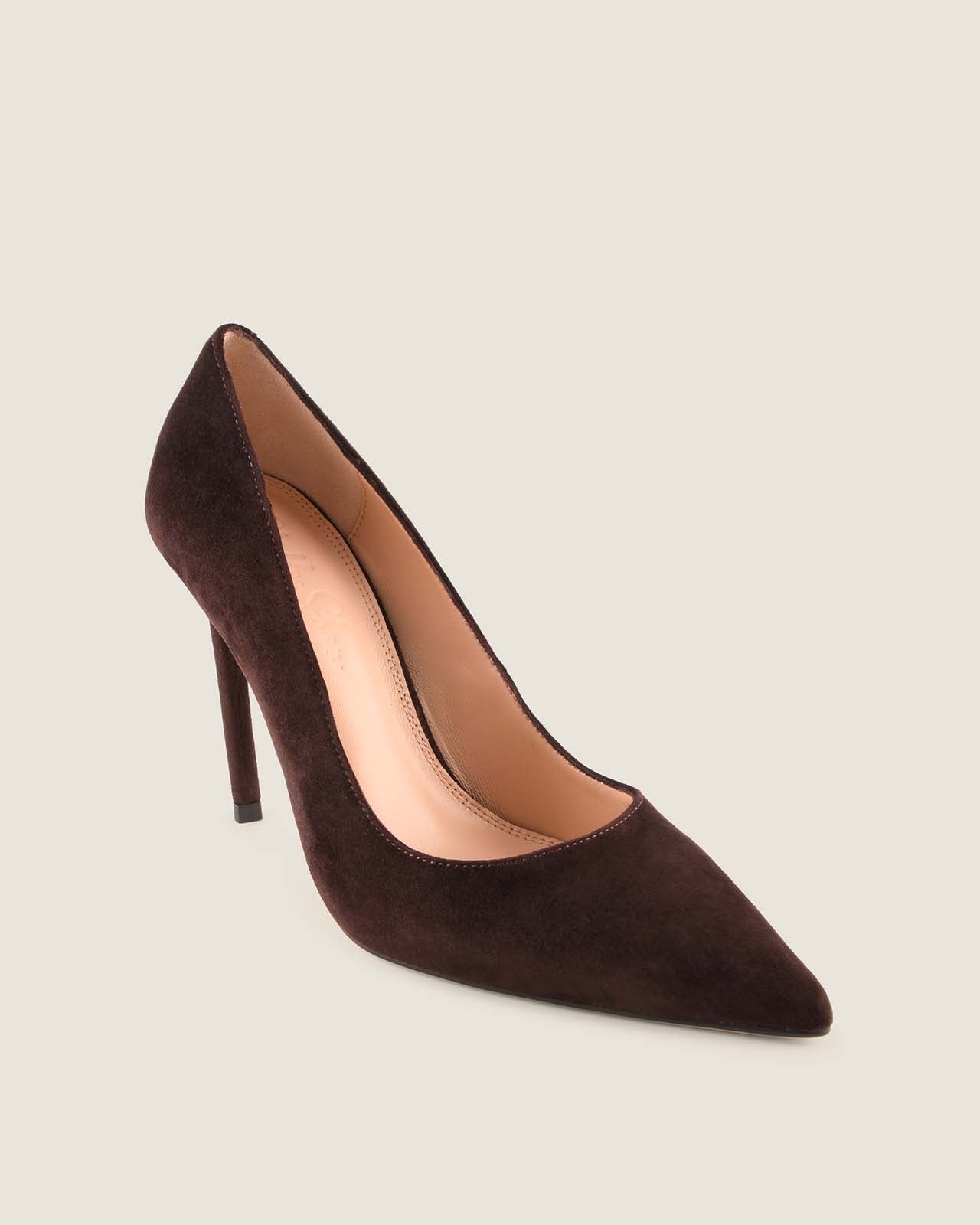 Brown high-heeled shoe on a light beige background
