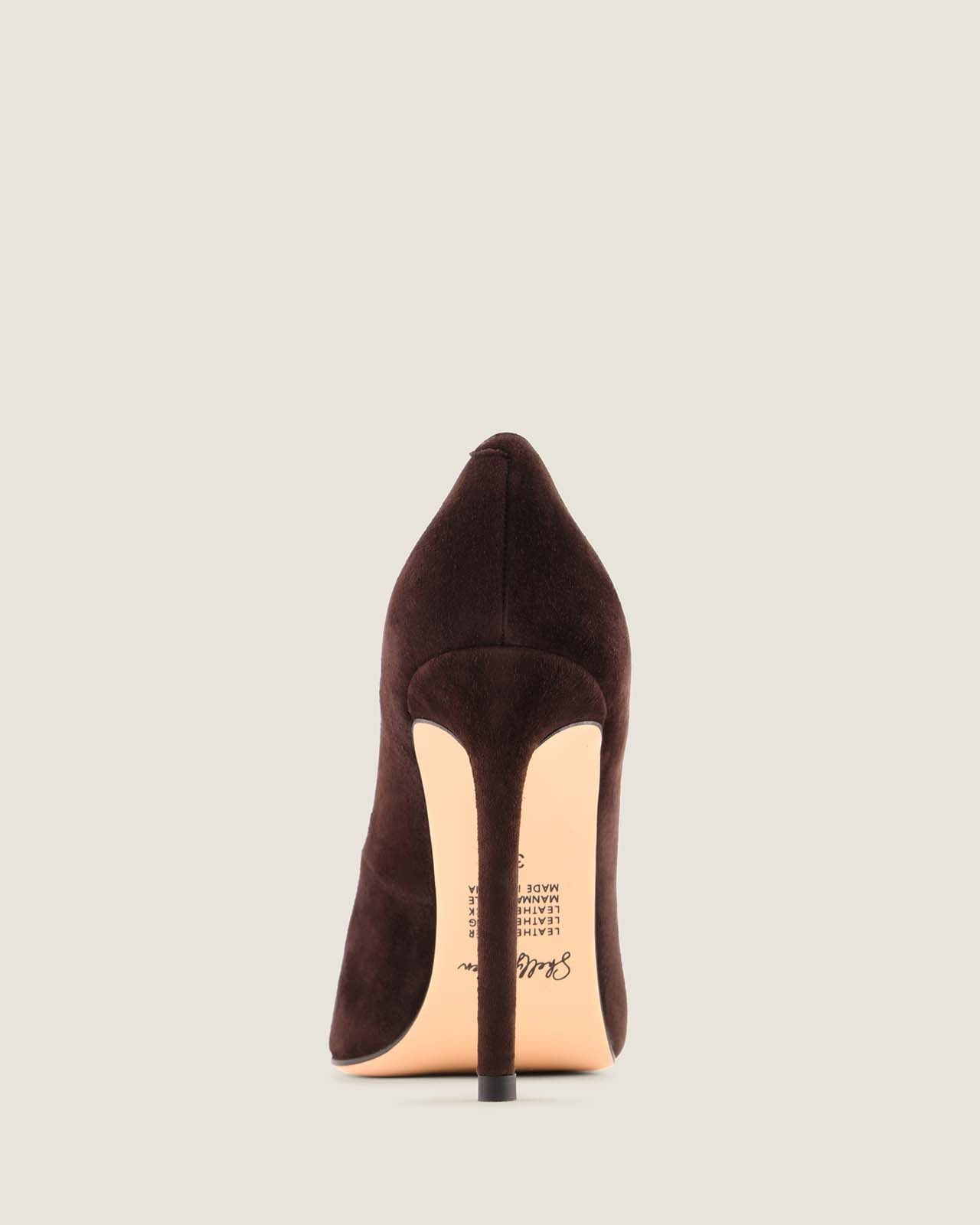 Brown high-heeled shoe on a light gray background