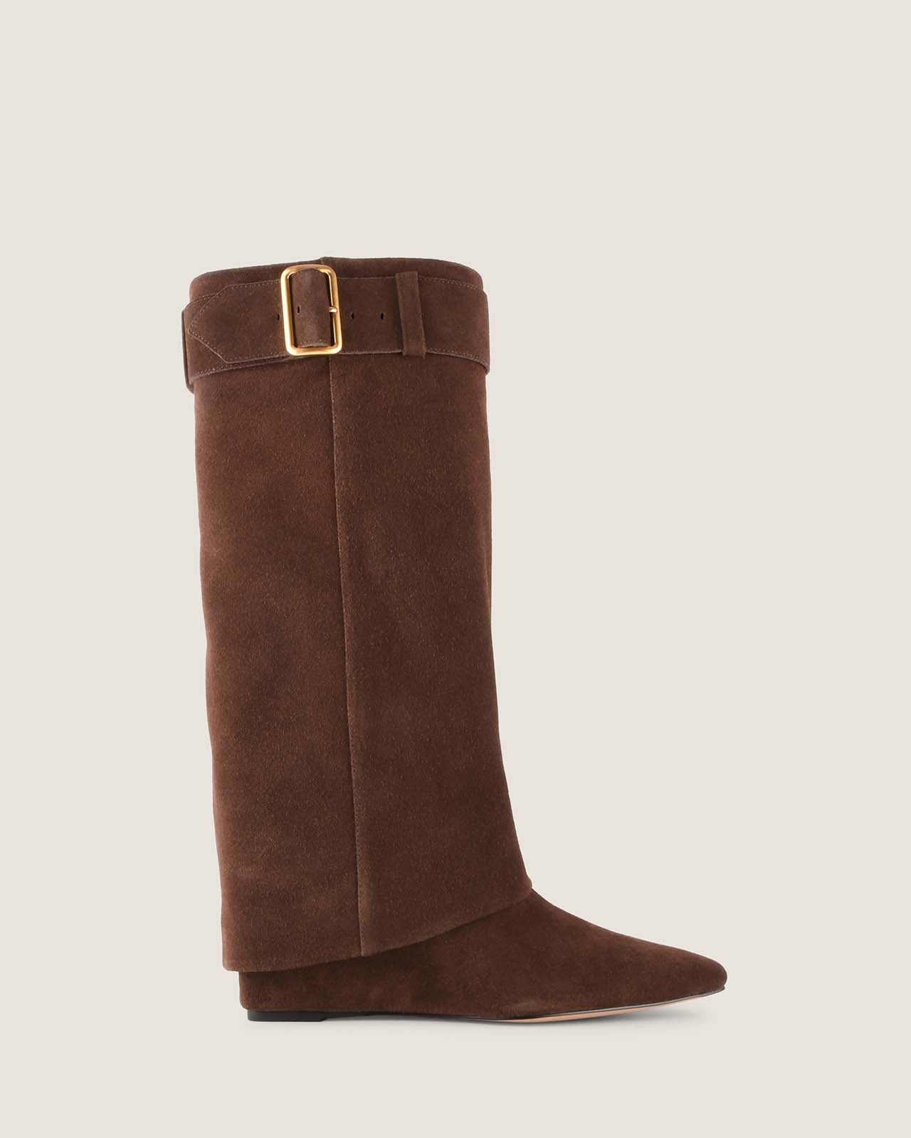 Brown knee-high boot with a gold buckle on a beige background