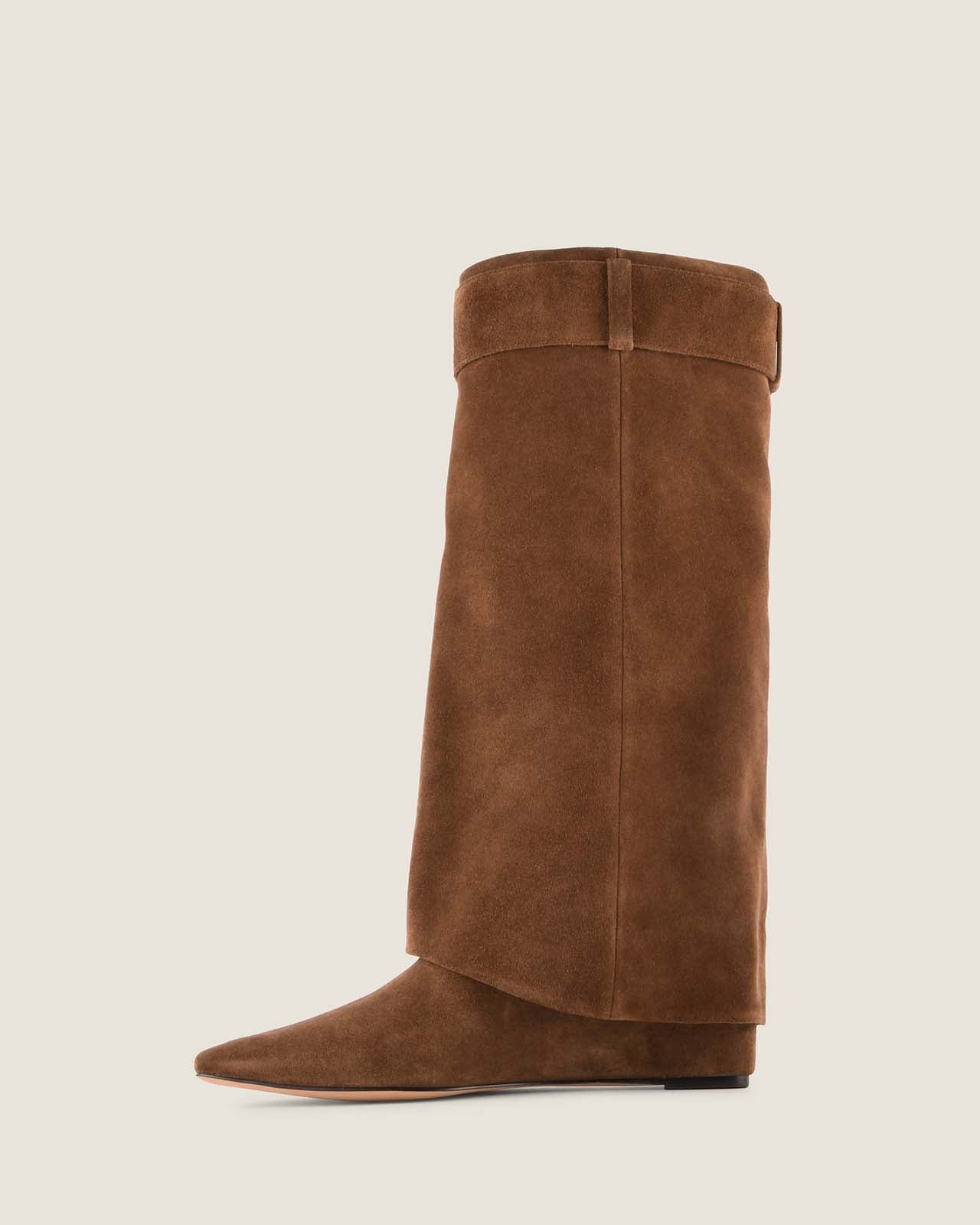 Brown knee-high boot on a light beige background