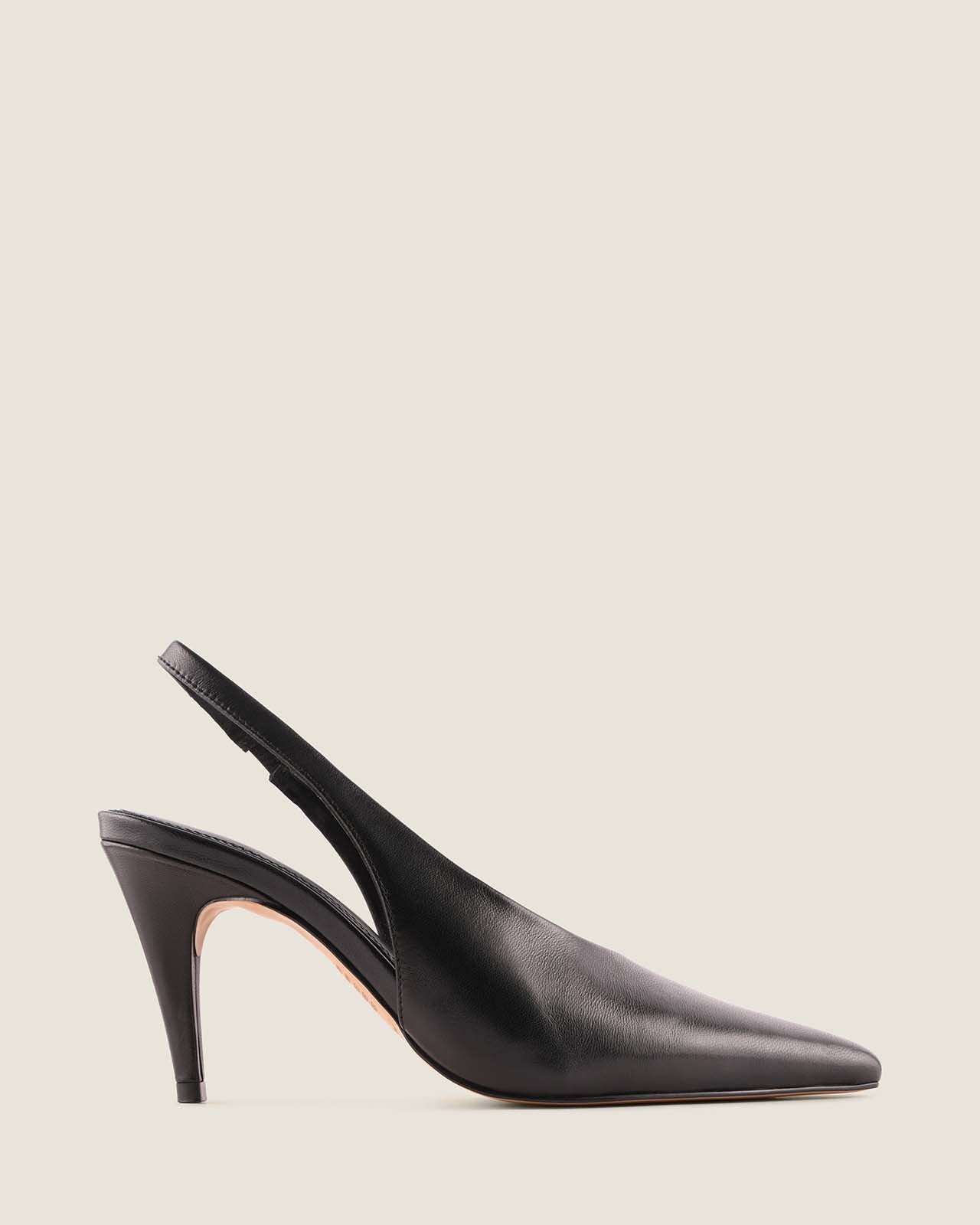 Black slingback pump on a light gray background