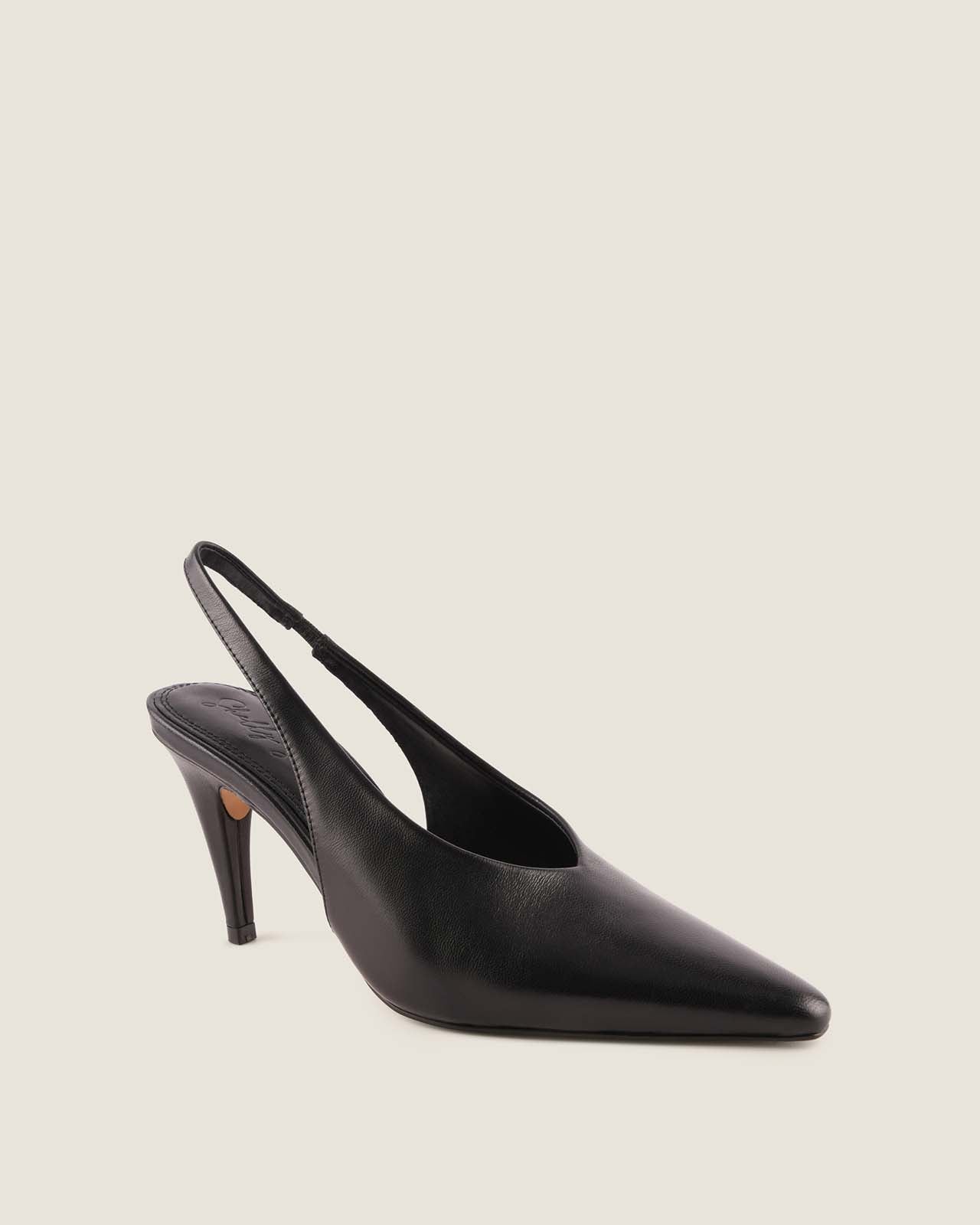 Black slingback shoe on a light gray background